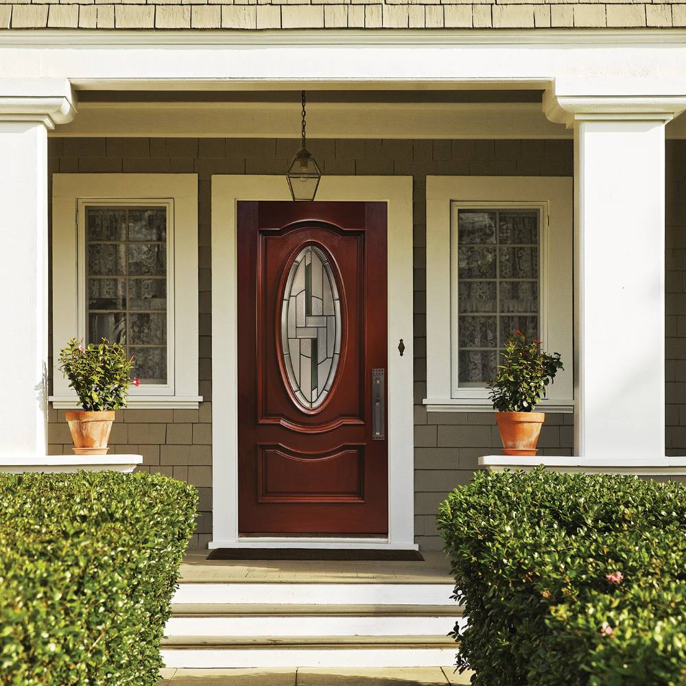 Elegant front door with decorative glass in center oval.