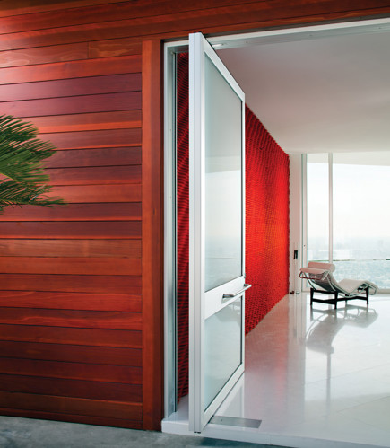 weiland glass and metal door with red walls and a city view