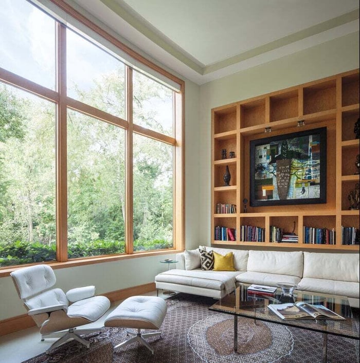 Andersen E-Series wood clad windows with stained wood interior.