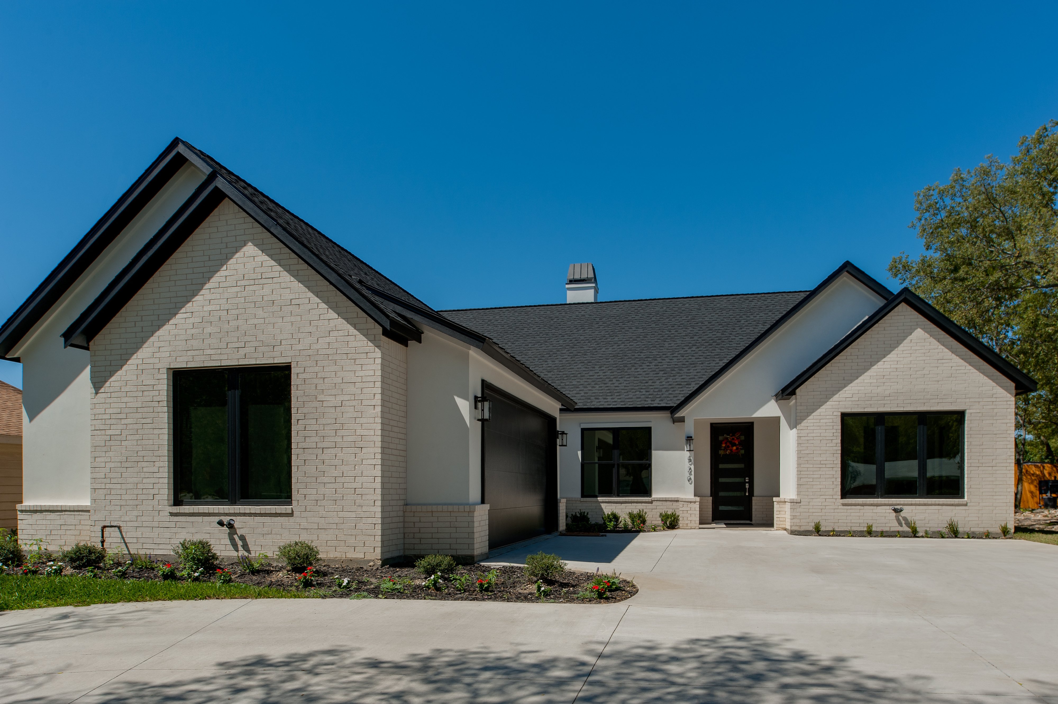 black-framed-windows-with-stucco-and-brick