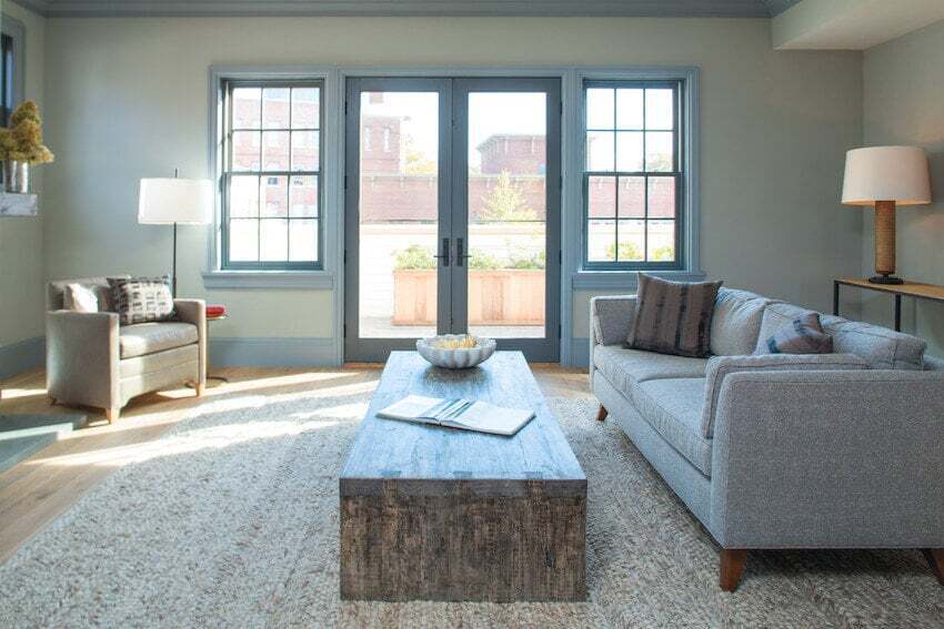 Photo of Andersen E-Series windows in Dove Gray finish. The windows blend in nicely in this cool tone living room.
