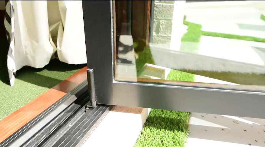 Closeup of sill hardware on folding door.
