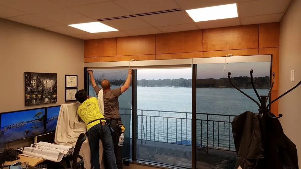 Installing pre-cut window film. Image: Source unknown