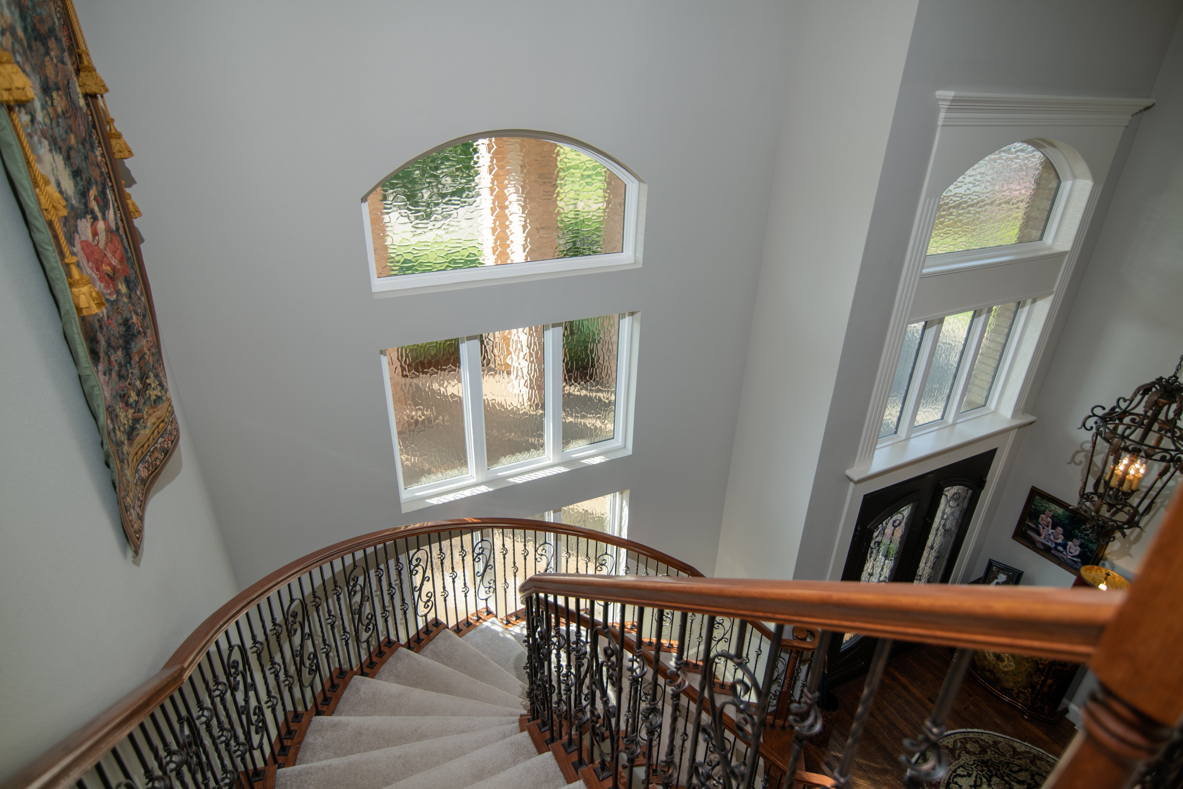 brennan-traditons-specialty-picture-windows-with-privacy-glass-stair-case-view
