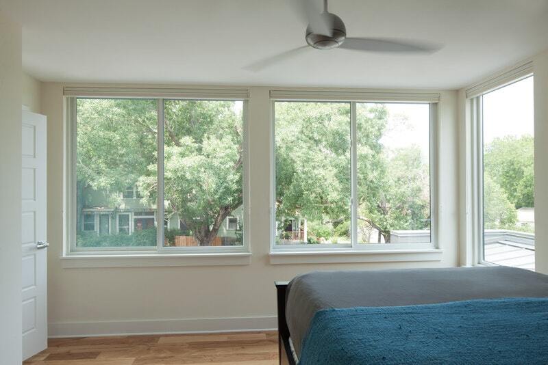 White sliding windows from Andersen's 100 Series. Image: Andersen Windows.