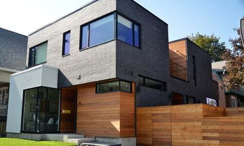 Example of Industrial Modern Style House with expansive gridless glass.