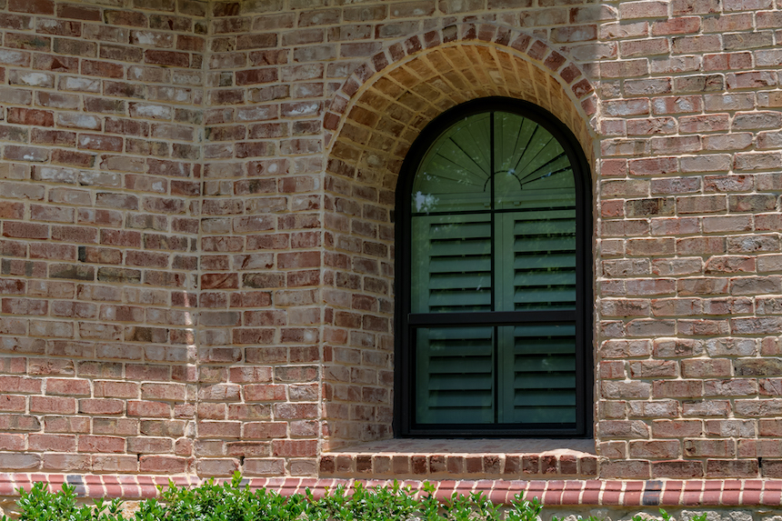 Circle top single hung window with grids