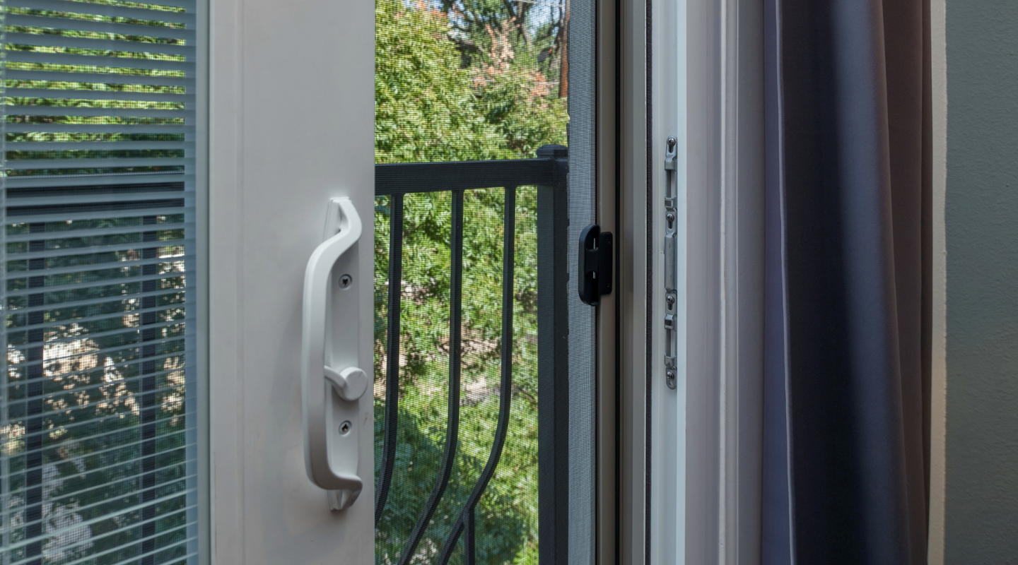 Sliding door handle and strike plate. Photo by Brennan.