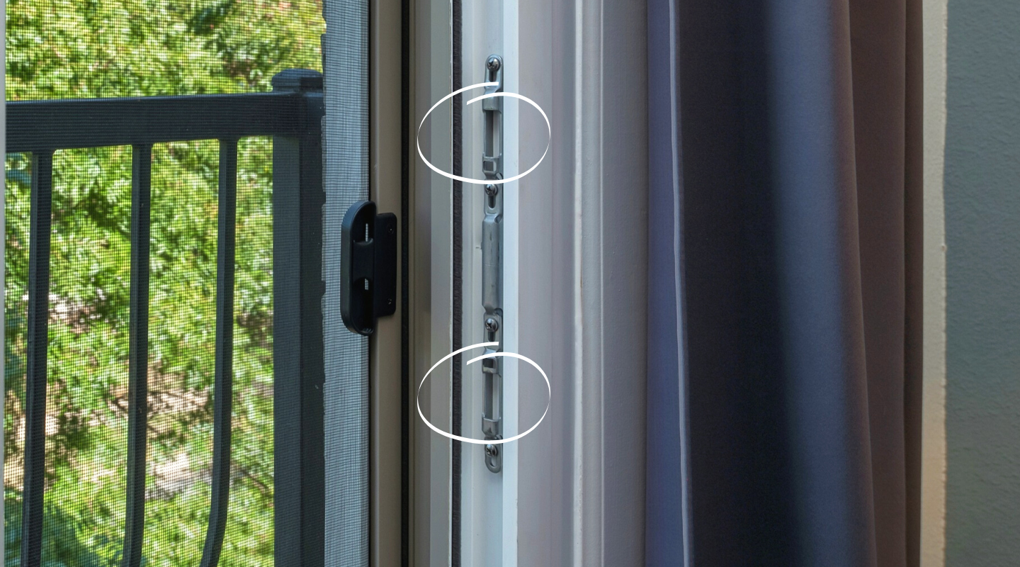 Door strike with latch receiving holes circled. Photo by Brennan.
