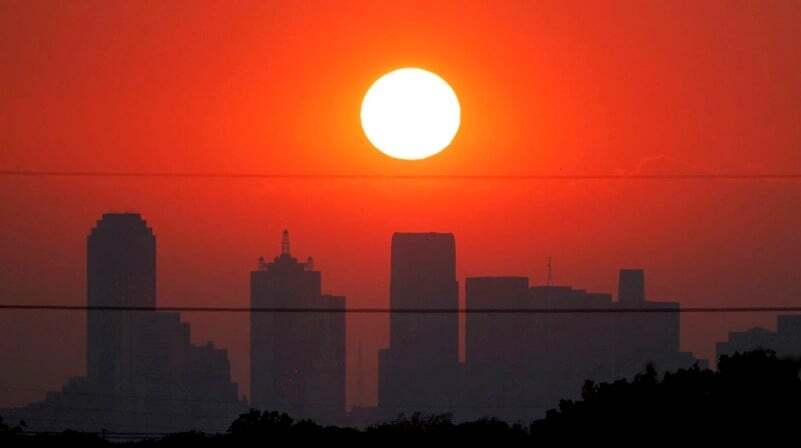 August sunset over Dallas skyline.