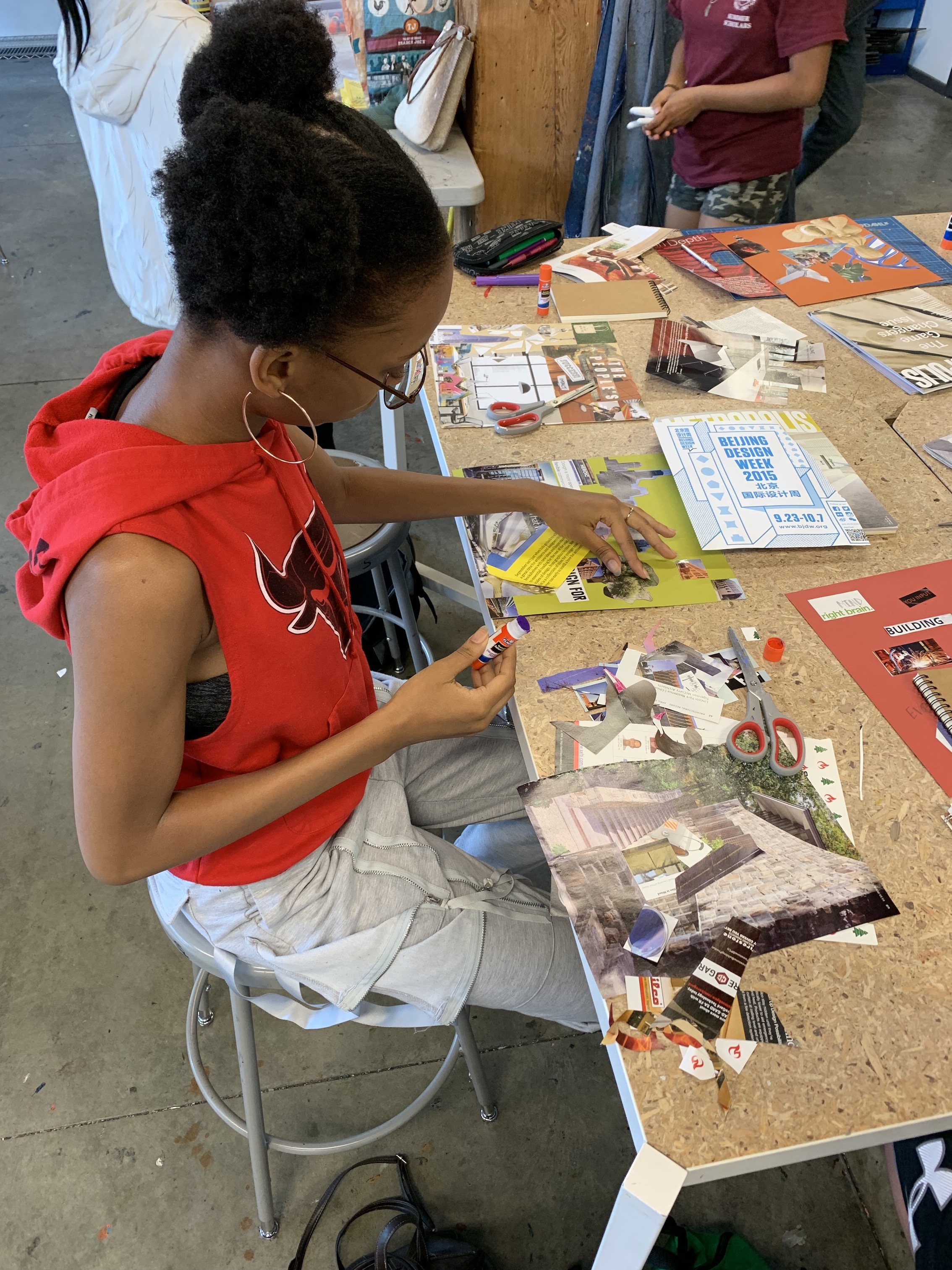 Design activity involving collage and image gathering.