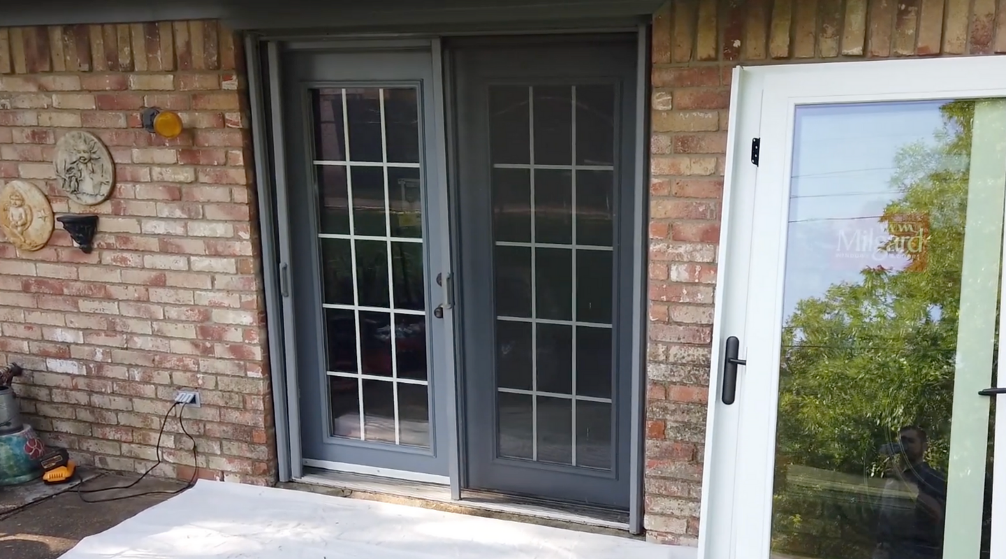 French patio door with damaged rails and damaged retractable screens. Photo by Brennan.