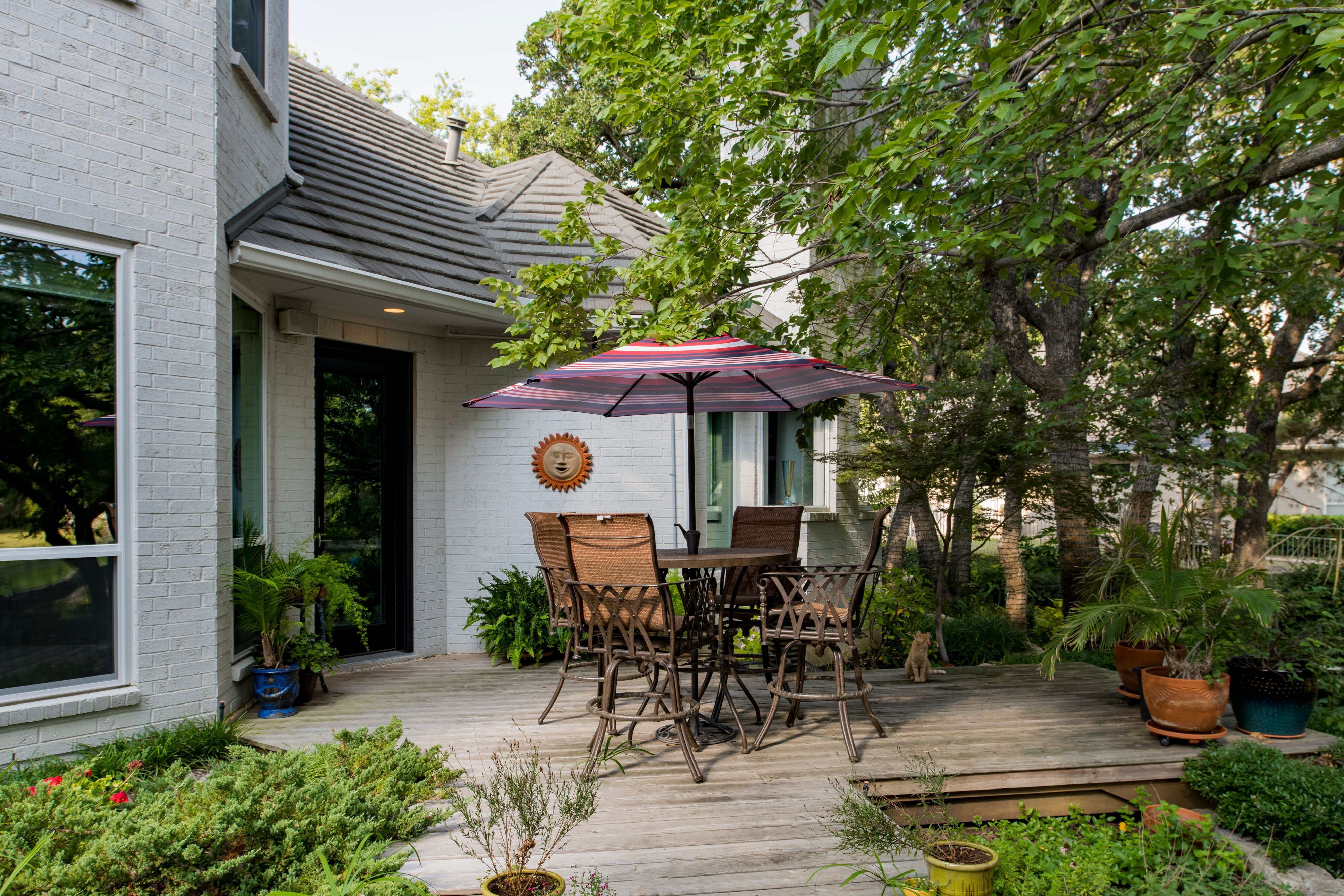 patio-view-of-black-hinged-provia-doors