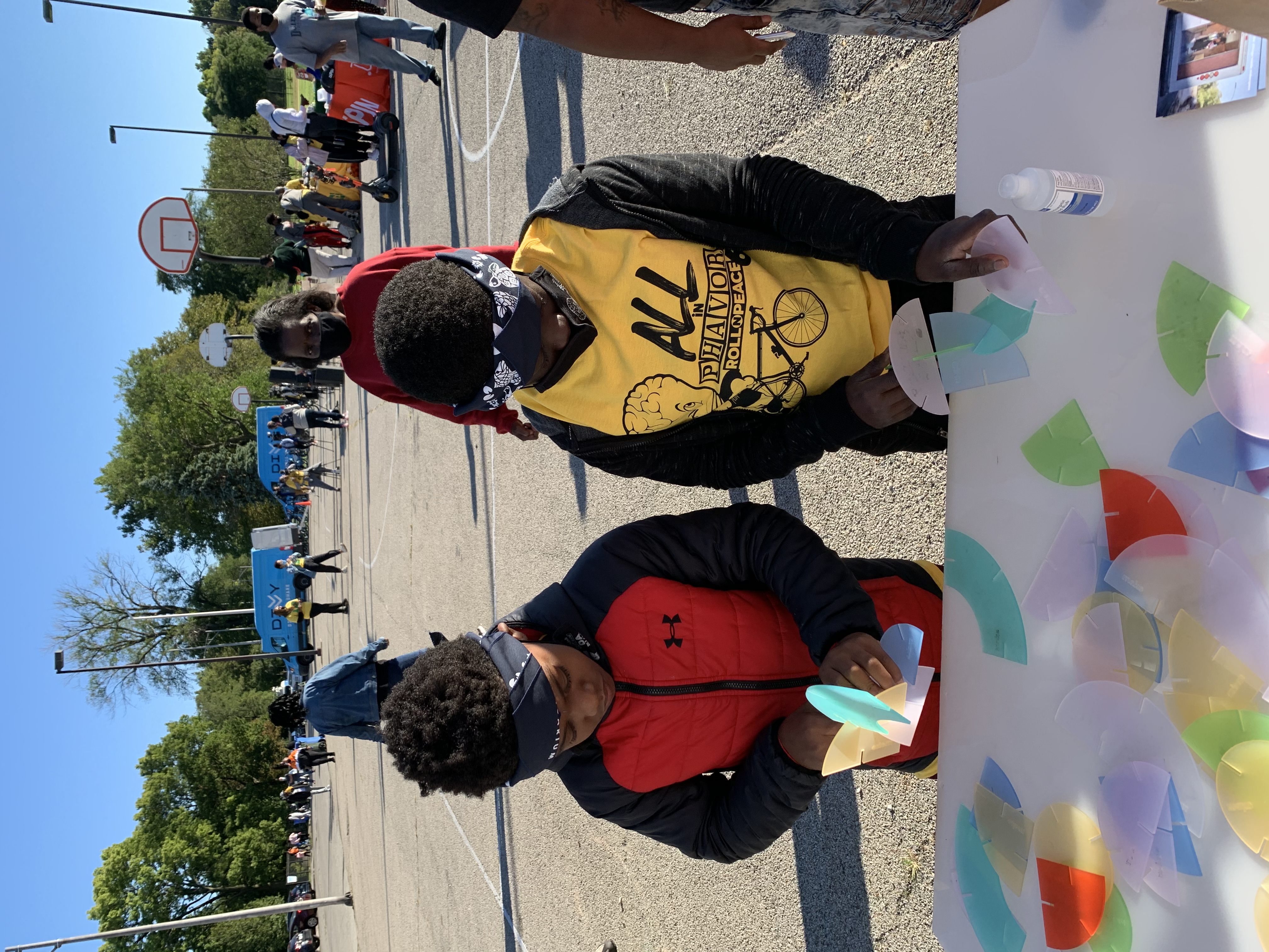 Children play with an interactive activity at a popup event.