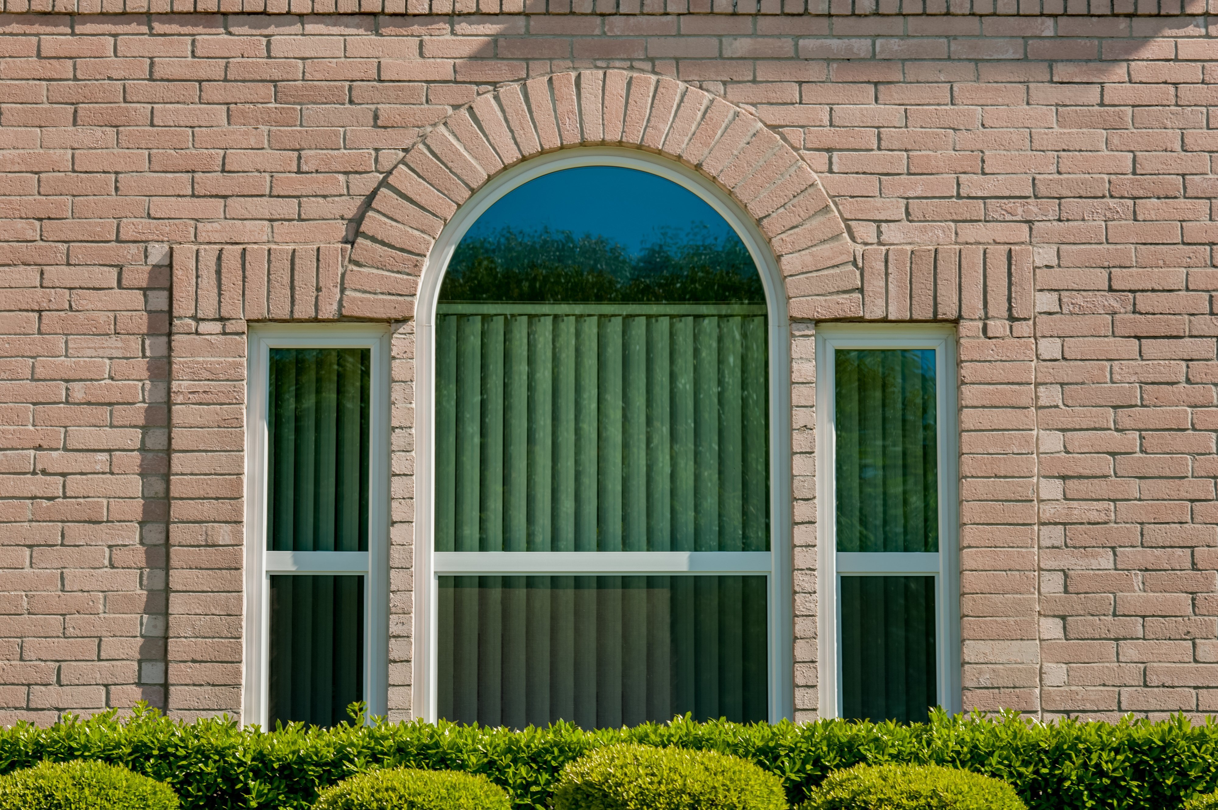 pink-brick-with-white-replacement-windows