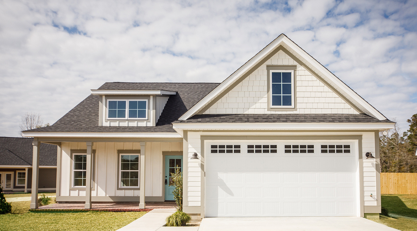 A blue door with gray trim. Photo from Adobe Stock.