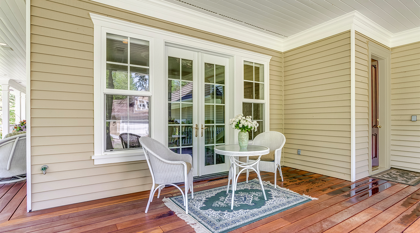 Or trim around the door matching the siding? Original photo from Adobe Stock.