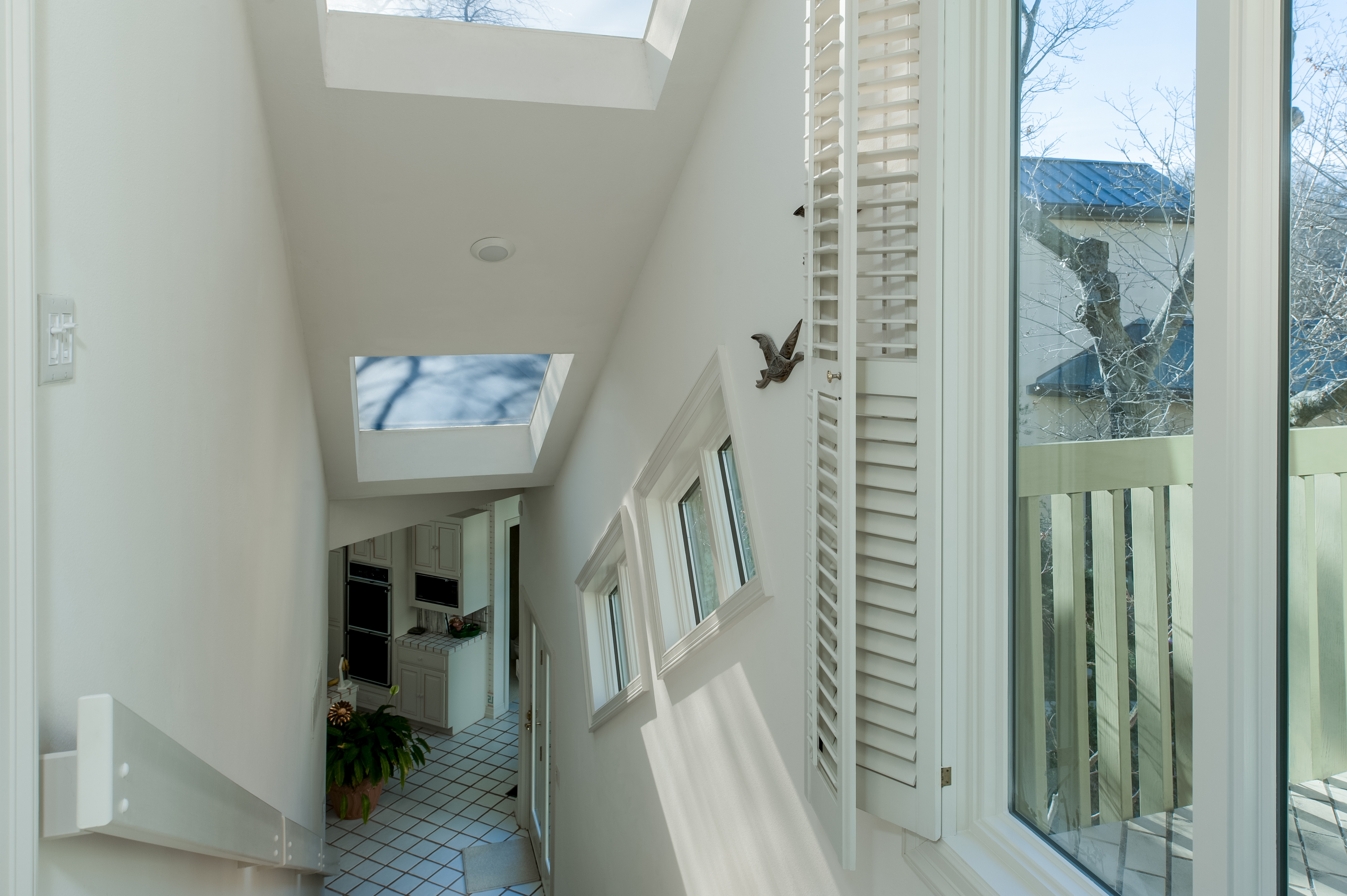 staircase-400-andersen-windows-with-white-shutters