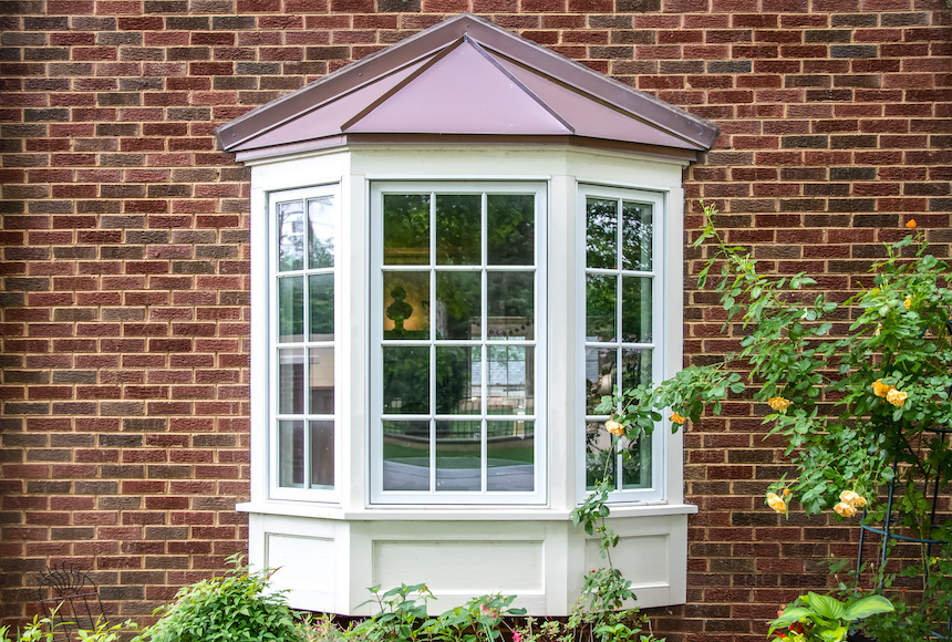 Woodclad bay window with grids