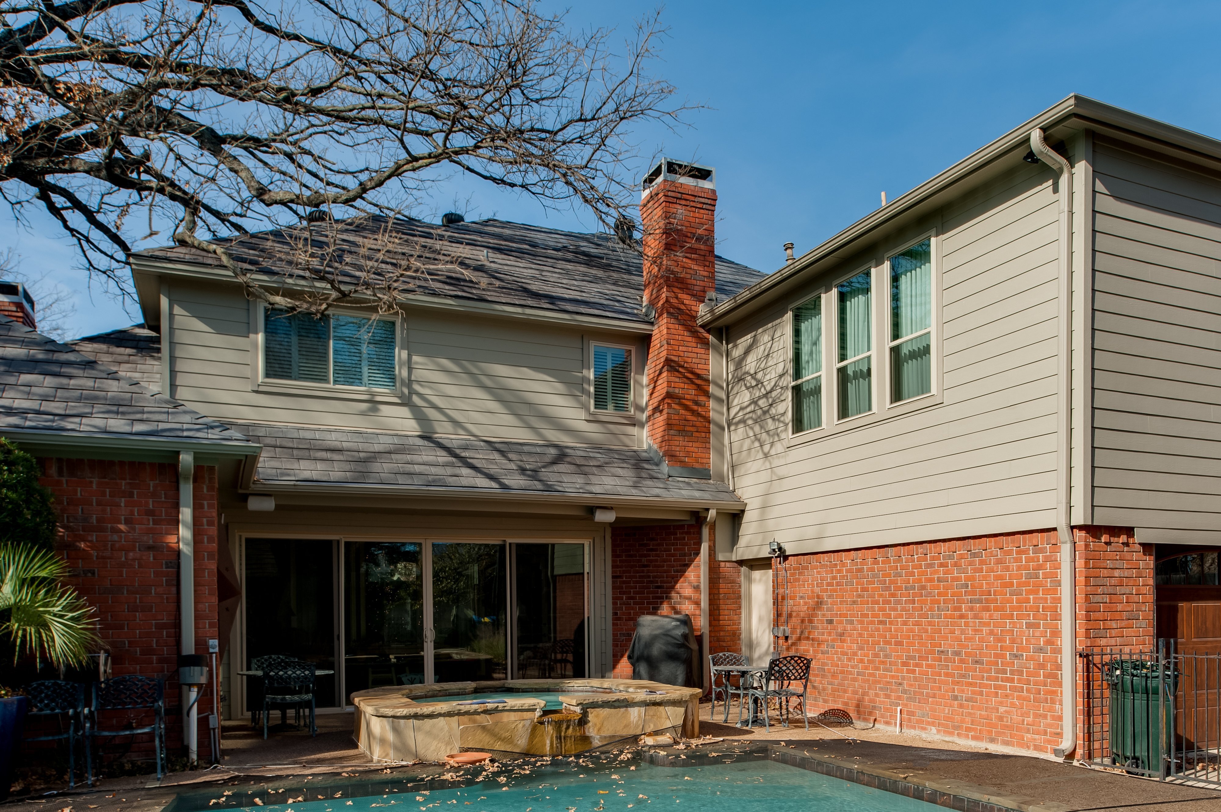 wide-view-of-backyard-with-jacuzzi-and-swimming-pool
