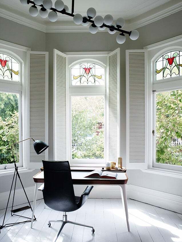 Windows with decorative art glass in modern home office.