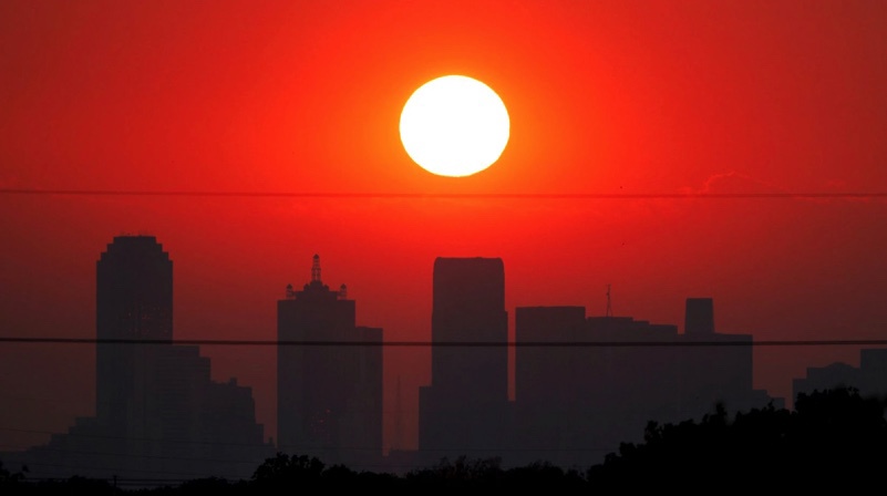August sunset over Dallas skyline.