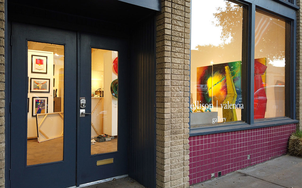Ellison Valencia Gallery storefront with black french doors, located in Bishop Arts District.