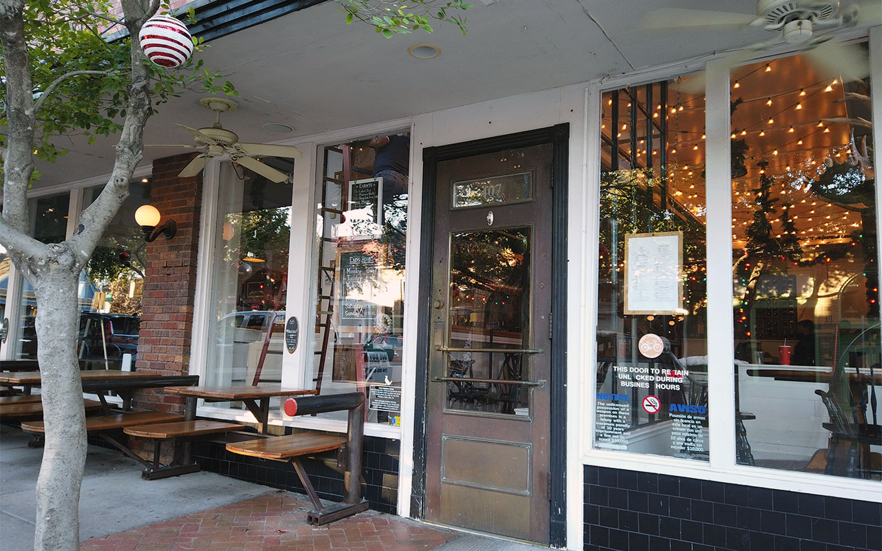 Restaurant storefront with built-in tables and benches, located in Bishop Arts District.