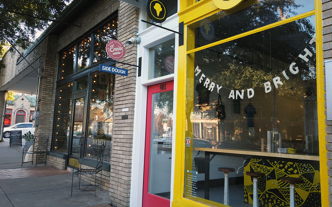 Colorful yellow, red, and white storefront at MELT icecream shop in Bishop Arts District.