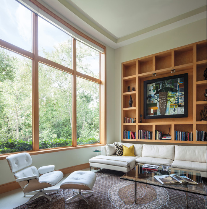 Andersen E-Series wood clad windows with stained wood interior.