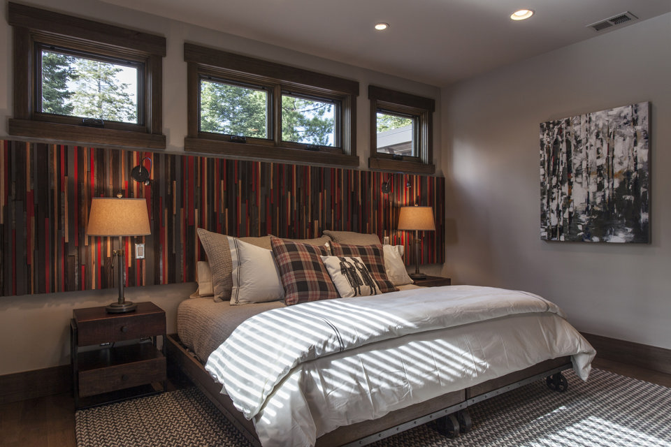Sierra Pacific offers solid wood windows. In this photo wood awning windows above the bed bring in additional light to this bedroom.