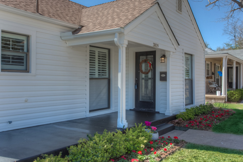 black porch with white siding