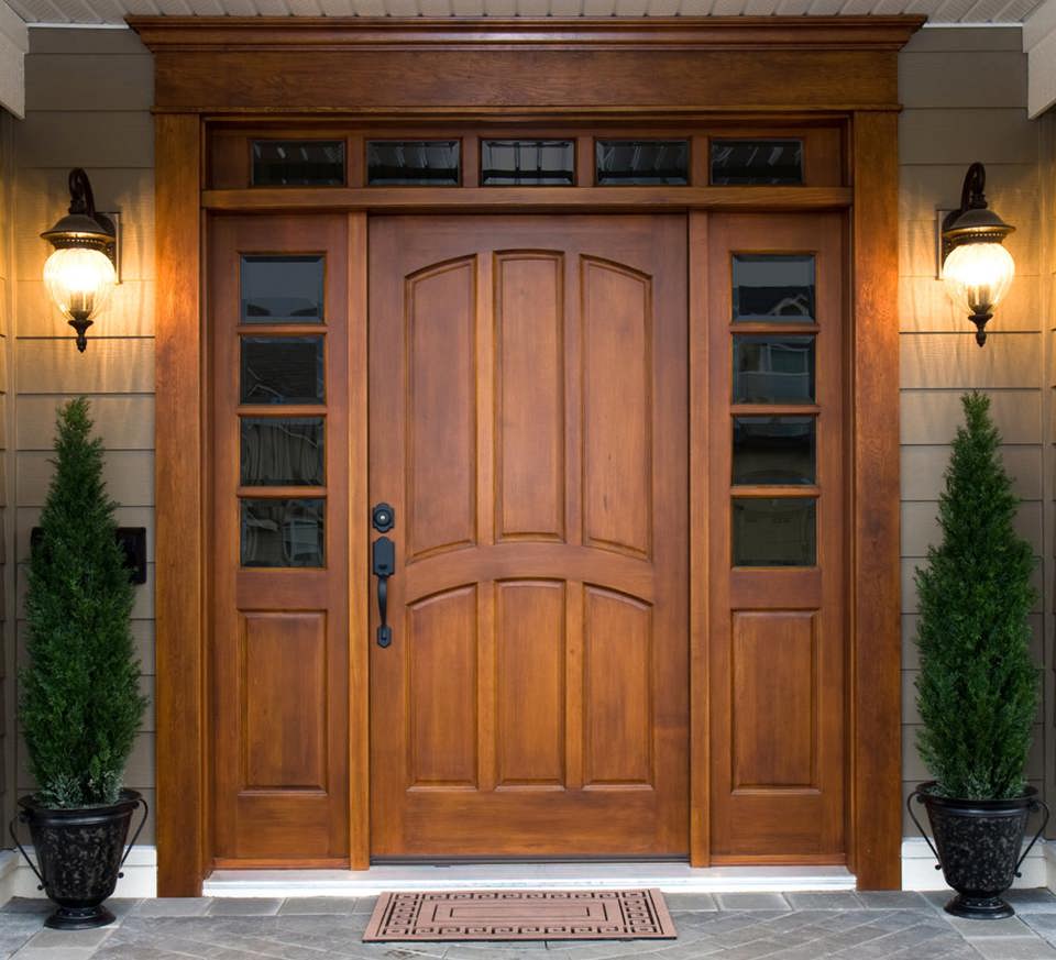 Elegant and classic wood door with sidelites and transom lites.