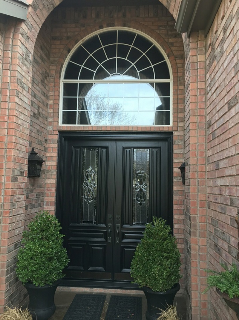 black french doors with specialty windows with white grids