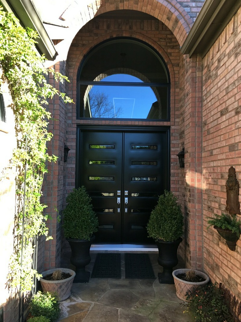 black provia french doors with specialty glass with black trim