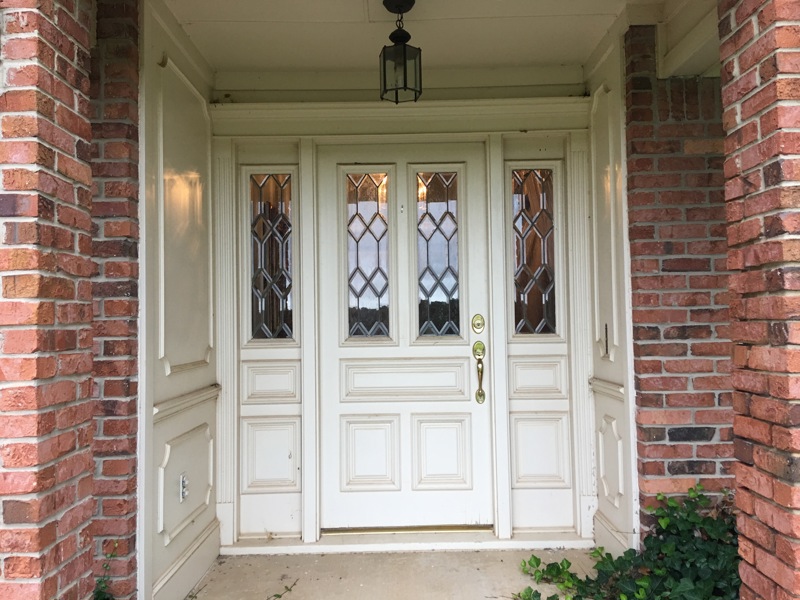 white french doors with designed glass