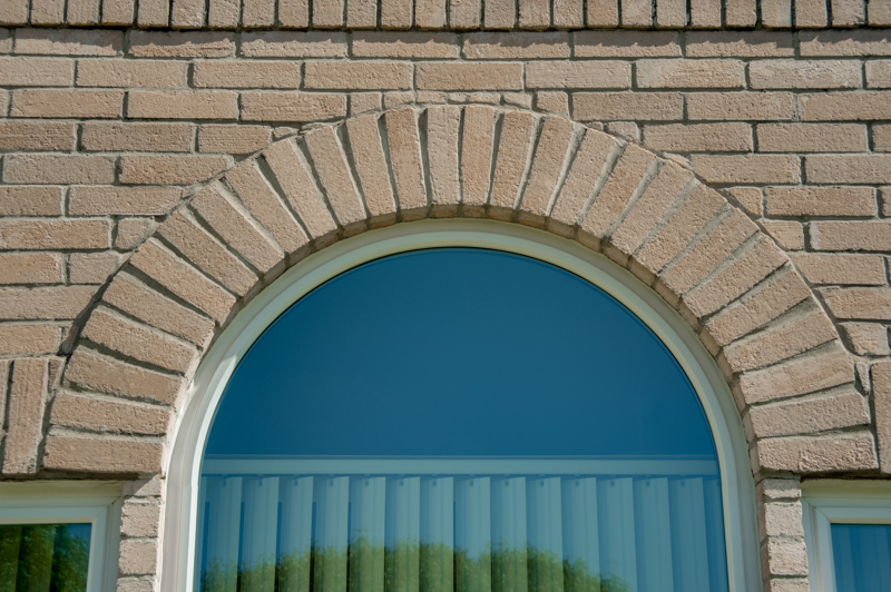 half-round-window-with-plantation-shutters