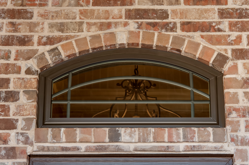brennan-traditions-bronze-full-arch-windows-with-prairie-grids