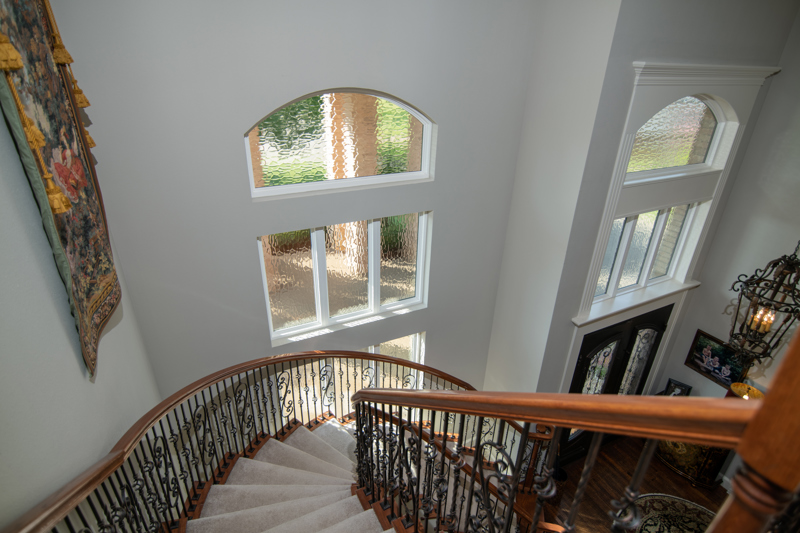 brennan-traditons-specialty-picture-windows-with-privacy-glass-stair-case-view