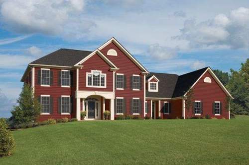 Deep red siding as an alternative to a traditional brick facade.