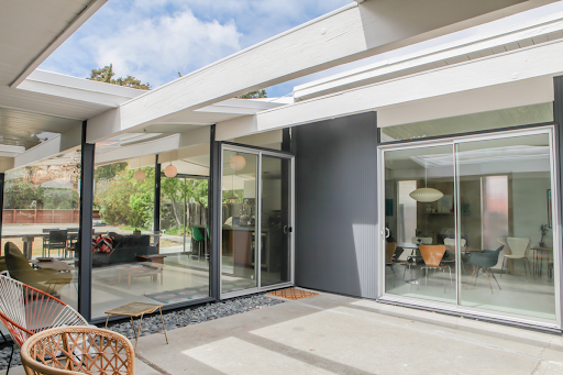 Aluminum sliding patio doors installed by Brennan provide generous views and natural light.