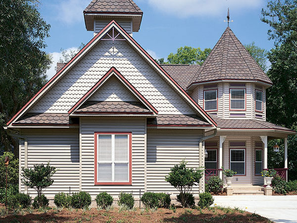 Example of home with scallop shingle siding and scallop shingle roof.