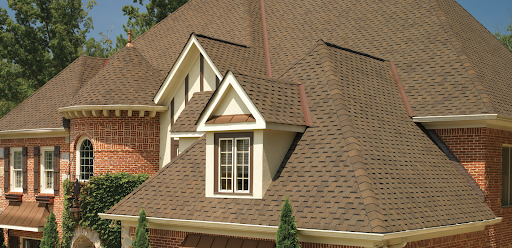 Large Neo-Victorian with light brown designer shingles.