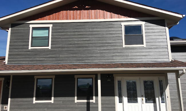 House with gray and brick red color siding
